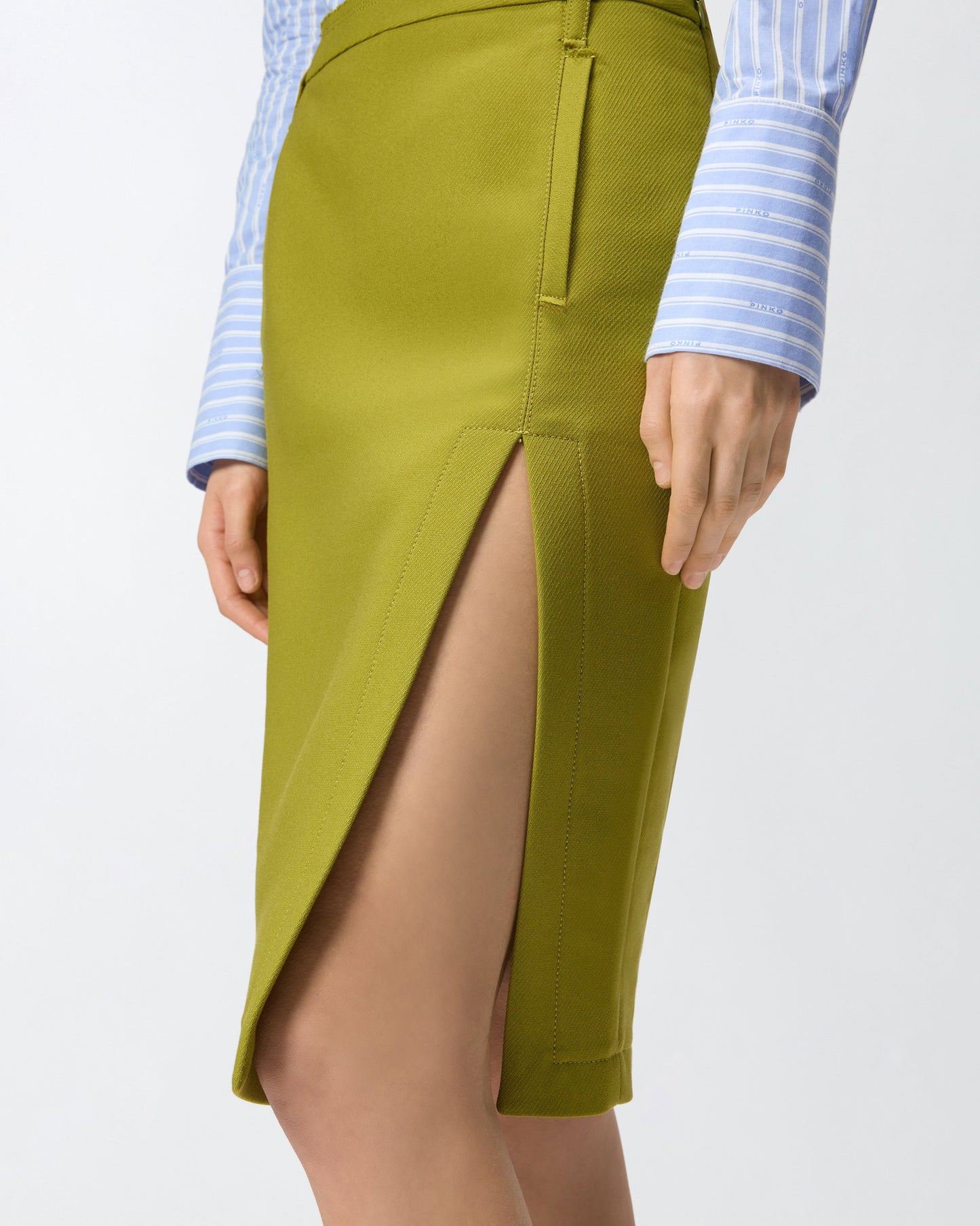 Slim-fitting calf-length skirt with slit