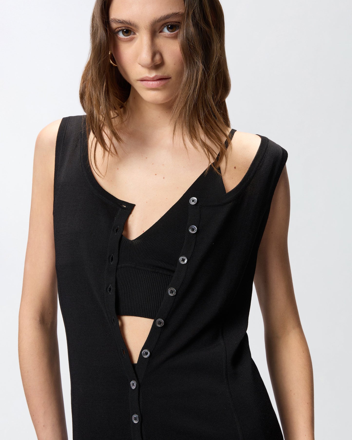 Knitted vest top with mother-of-pearl buttons