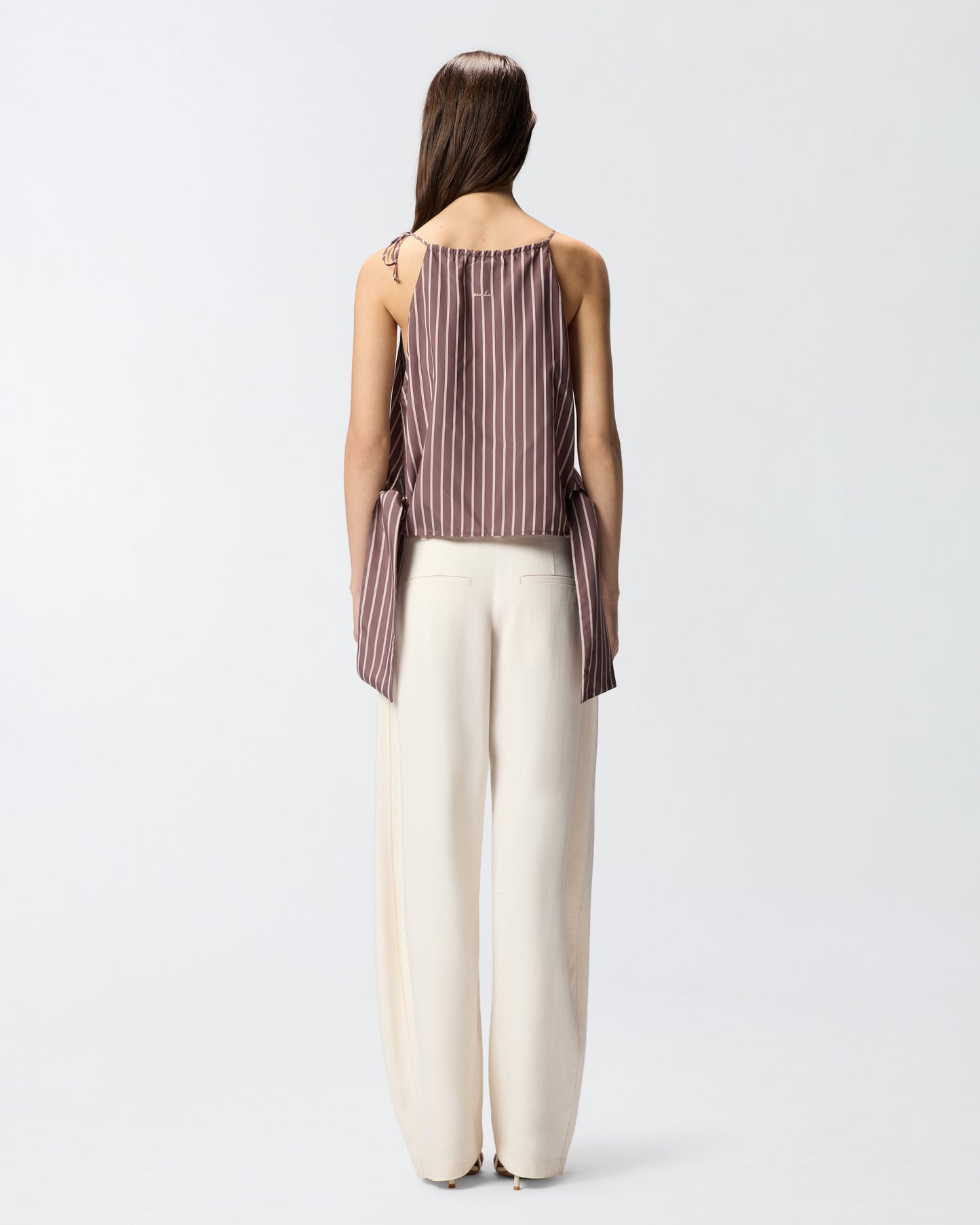Striped top with thin shoulder straps and bows