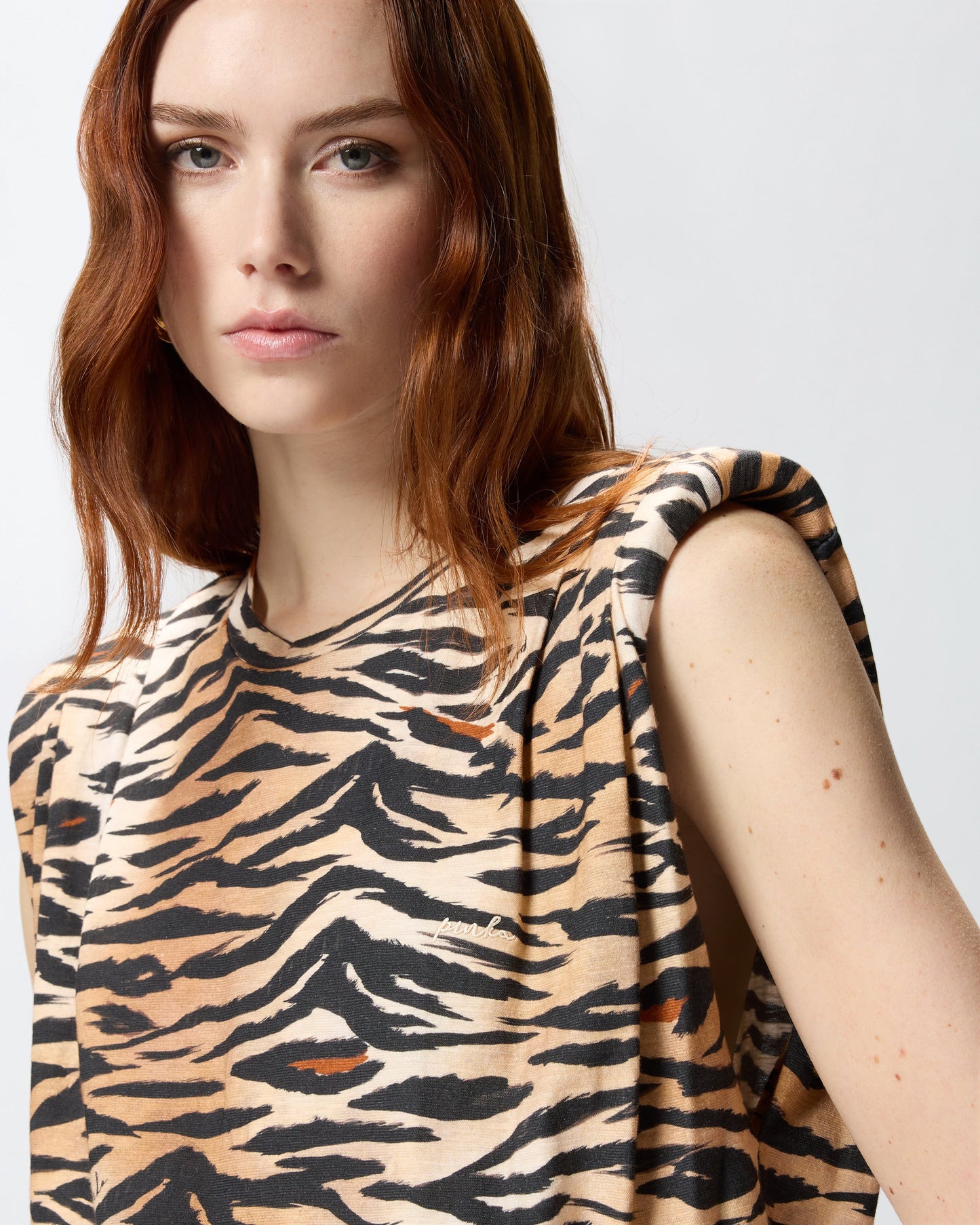 Sleeveless sweater with tiger print