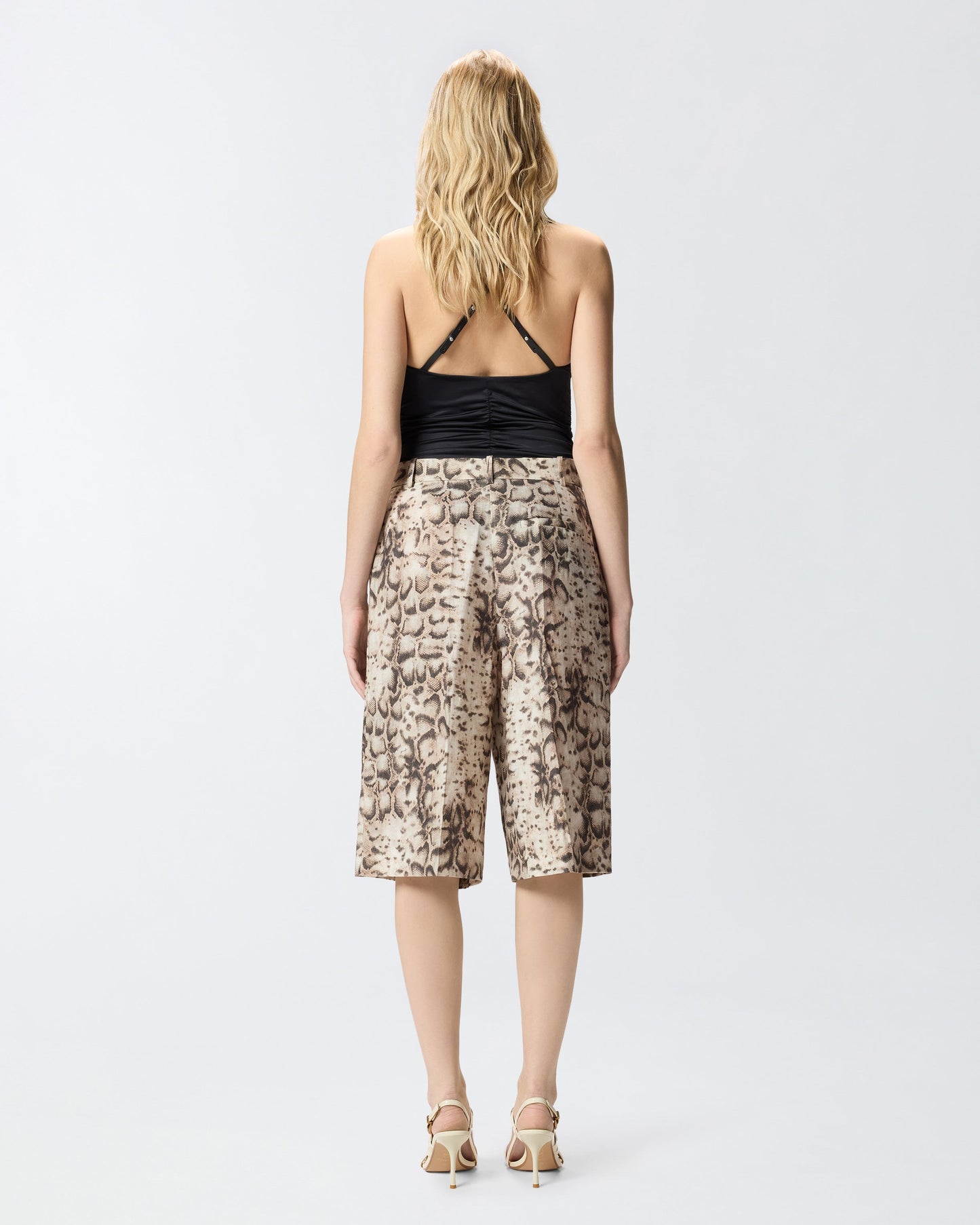 Bermuda shorts with snake print