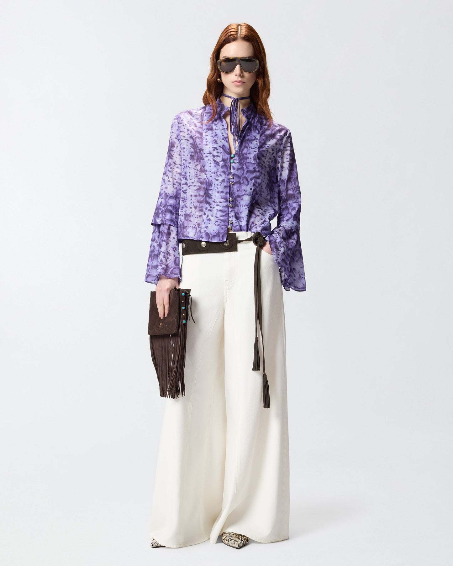 Blouse with snake print and jewel buttons