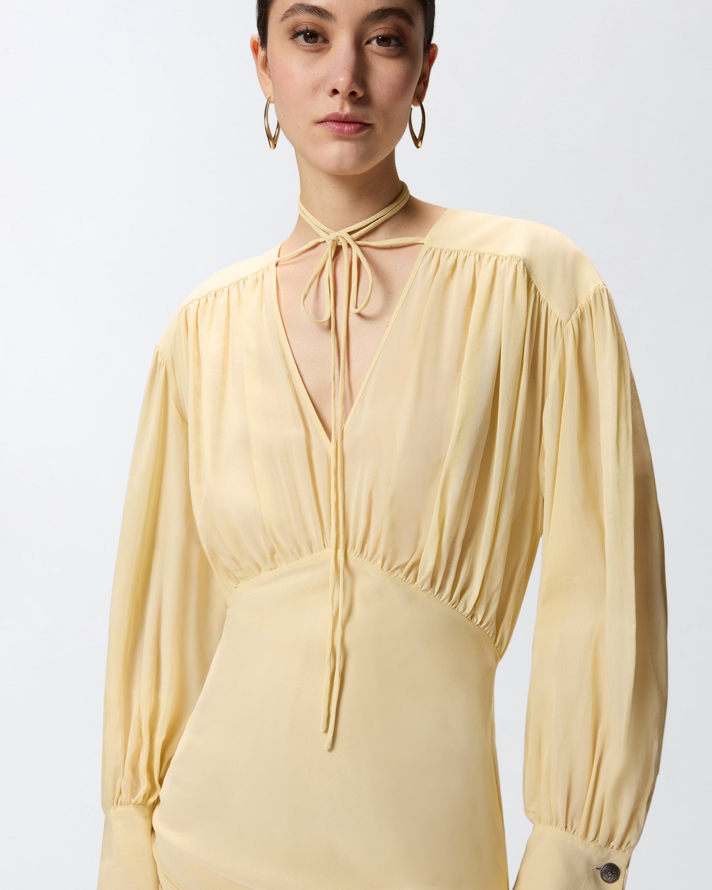 Mini dress with long sleeves and draping