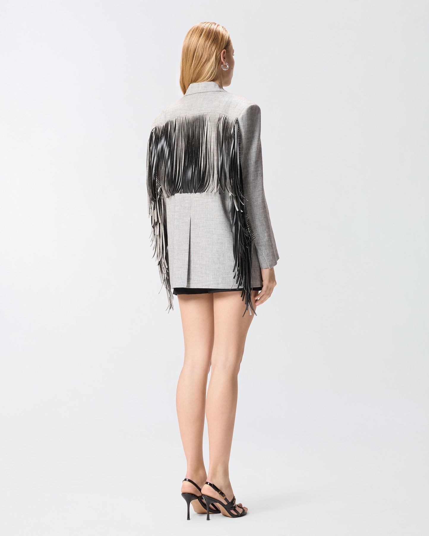 Double-breasted jacket with fringing