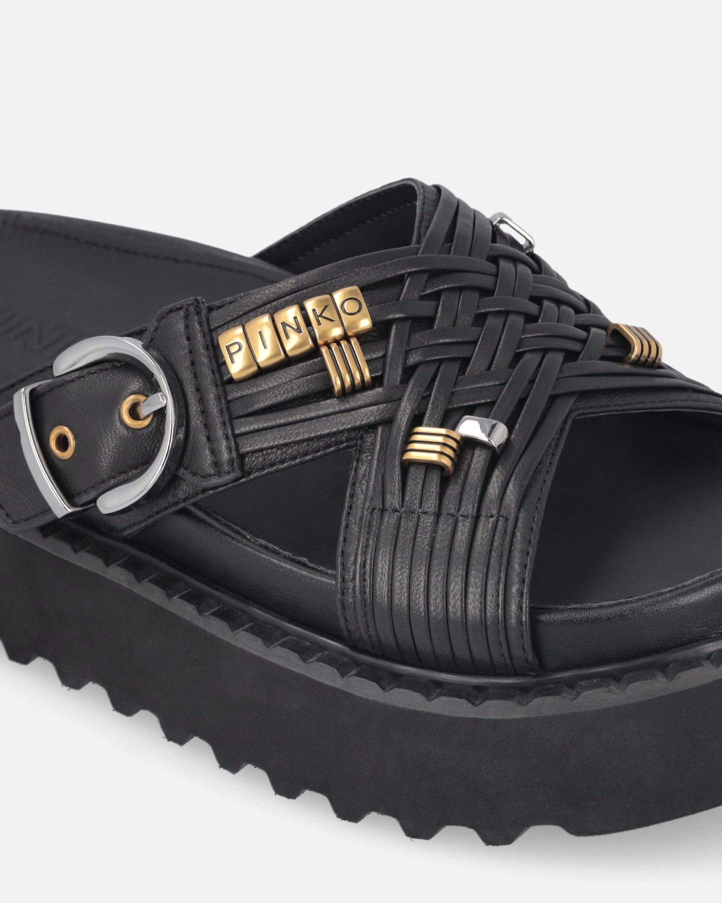 Woven nappa leather slip-on sandals with metallic rings